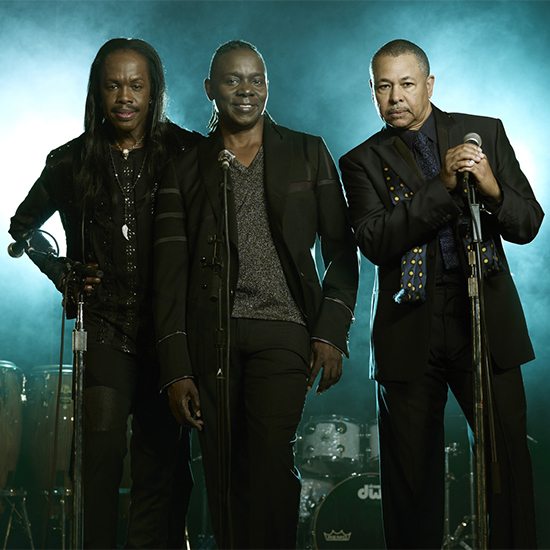 Earth Wind And Fire In Front Of Blue Background